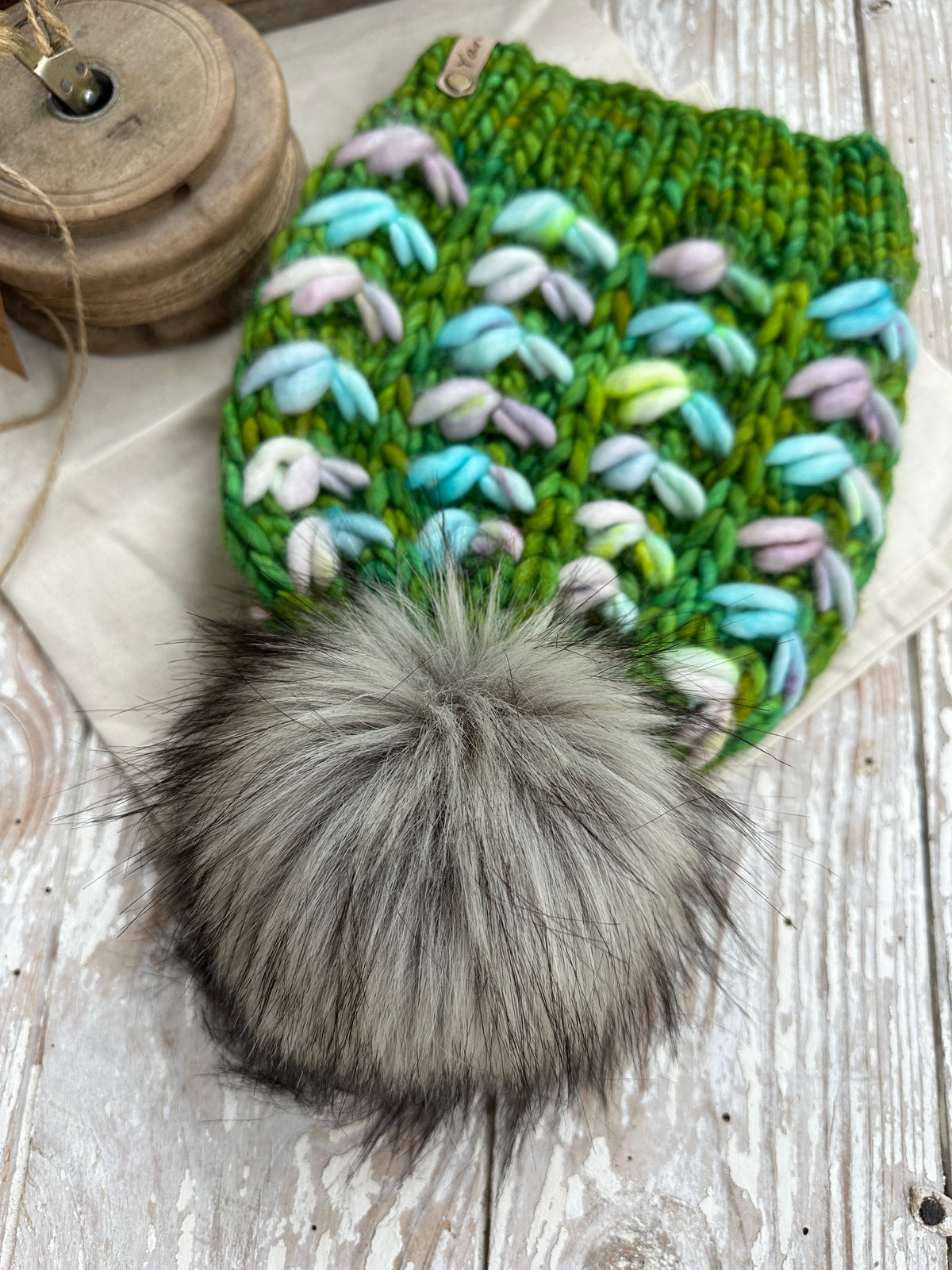 Merino wool knit hat with faux fur Pom