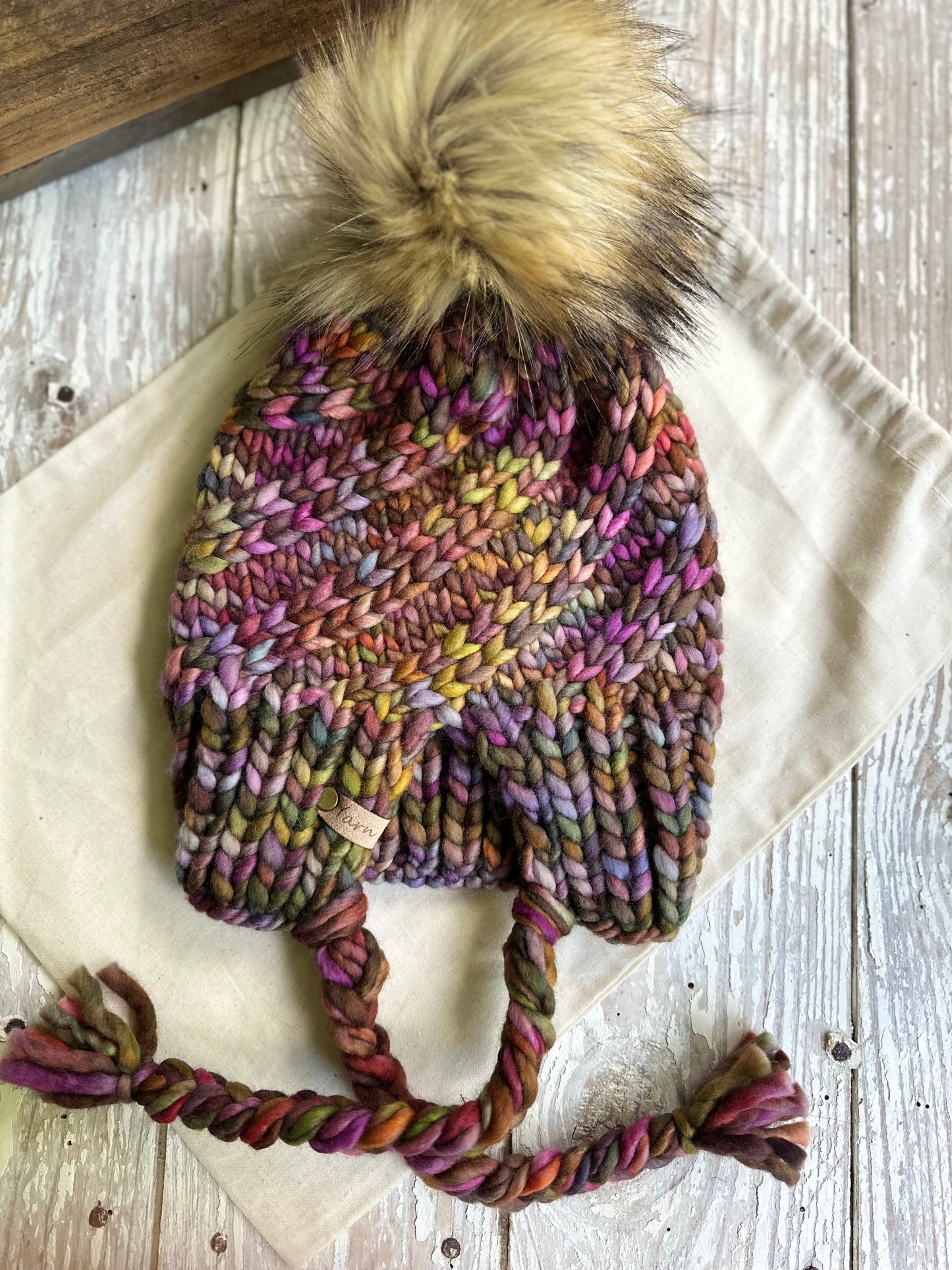 Merino wool split brim knit beanie with faux fur pom
