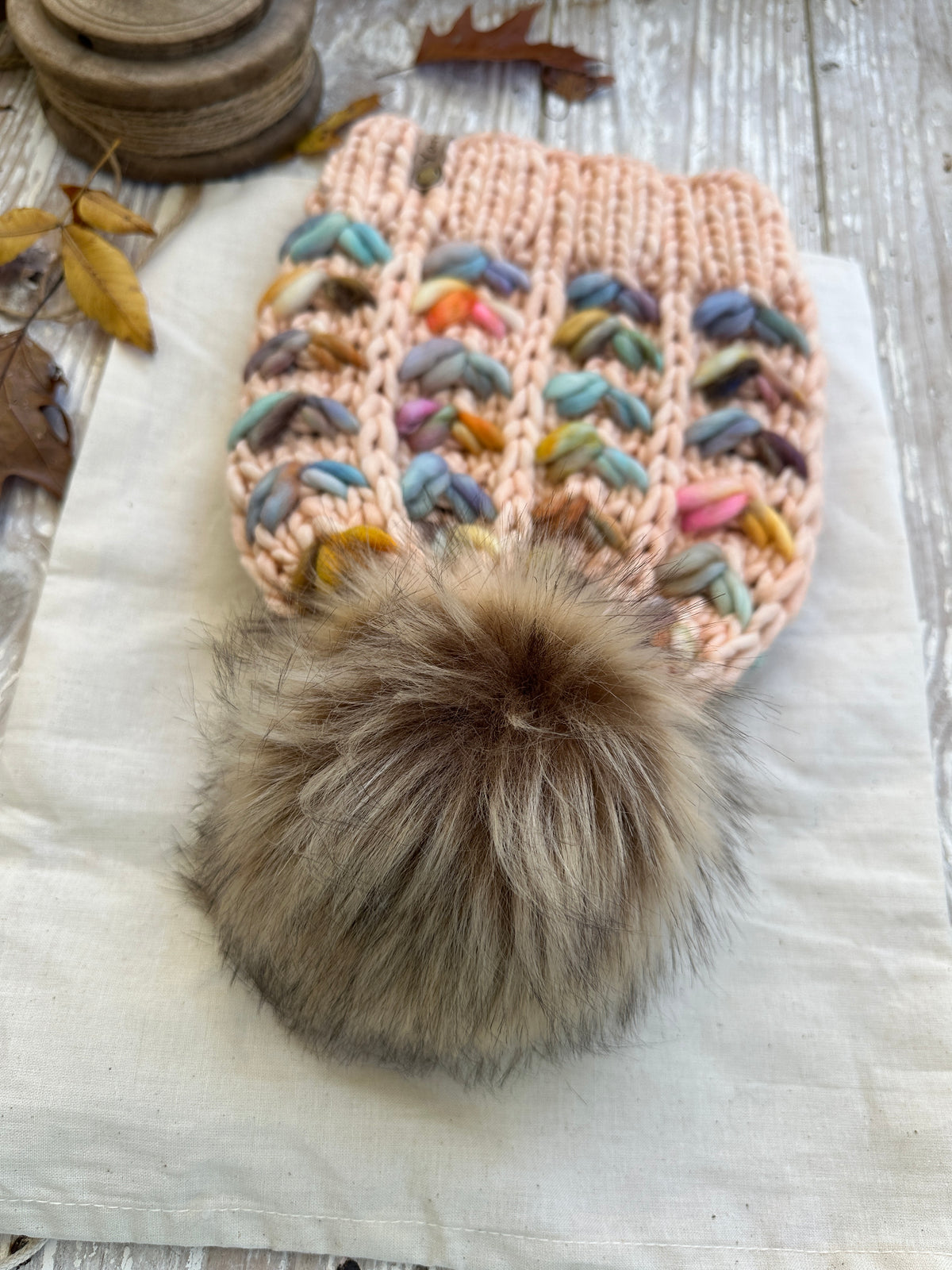 Merino wool knit hat with faux fur Pom