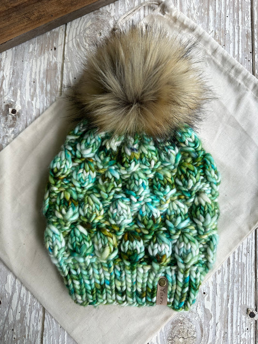 Slouchy merino wool knit hat with faux fur pom
