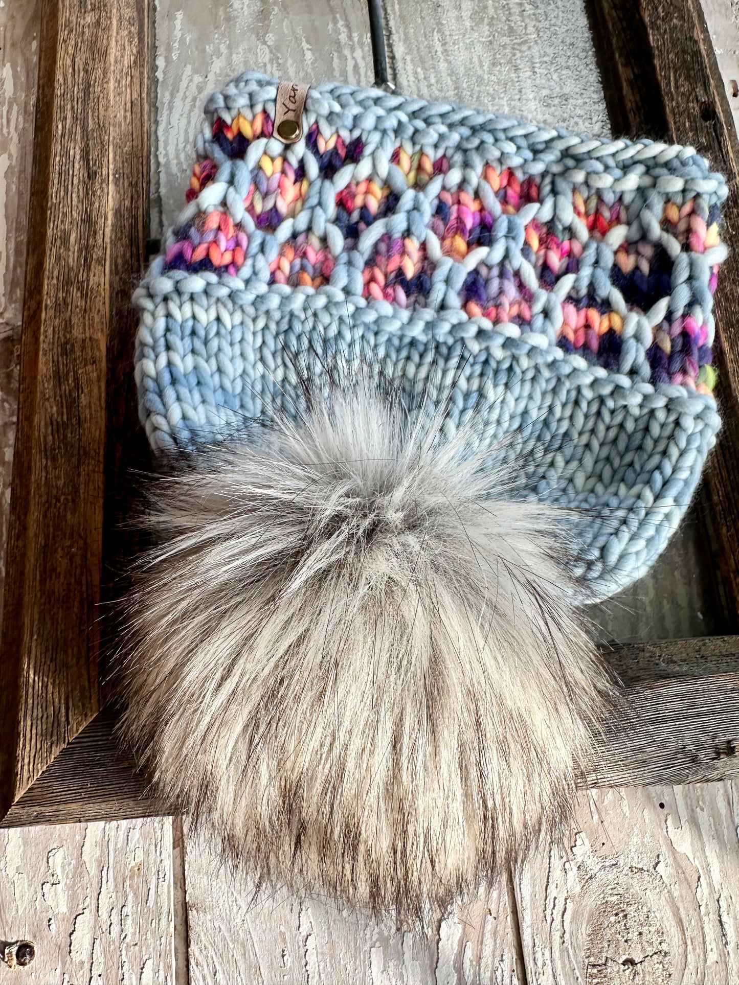 Merino wool knit hat with faux fur Pom
