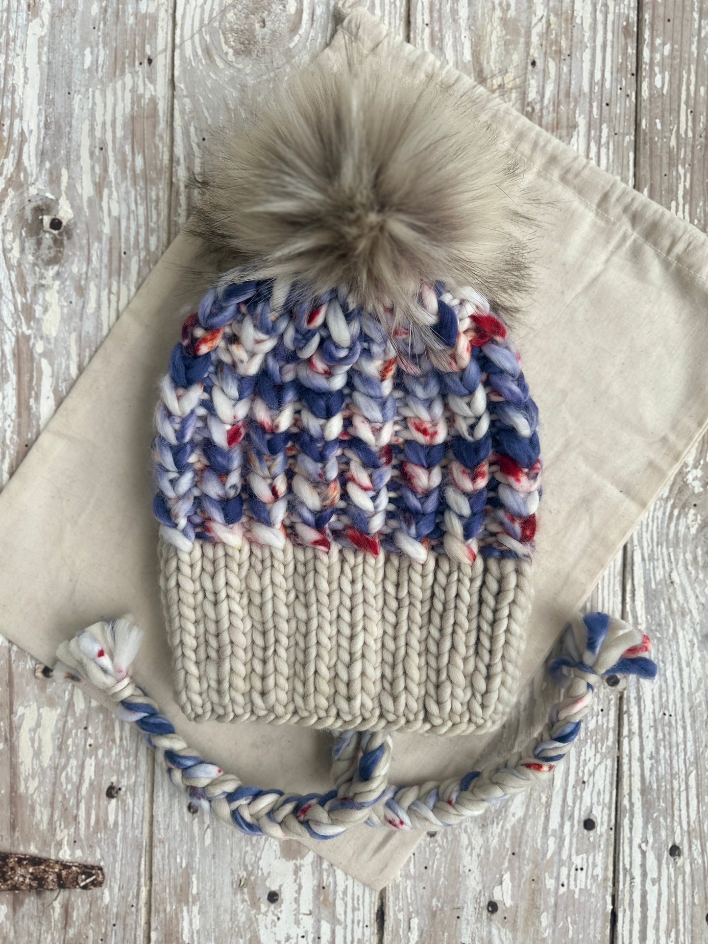 Sports themed merino wool split brim knit hat with faux fur Pom