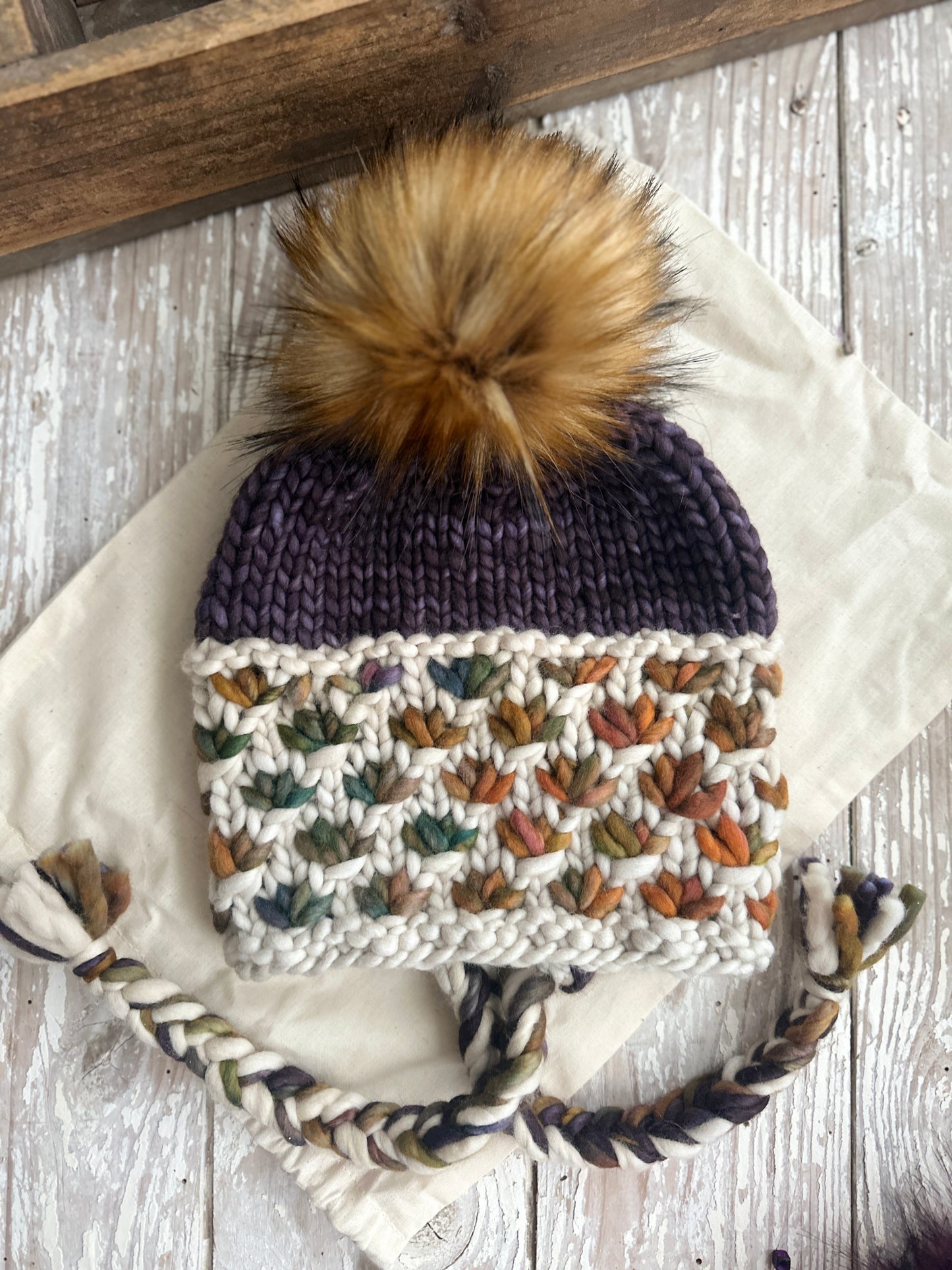 Merino wool knit split brim beanie with faux fur Pom