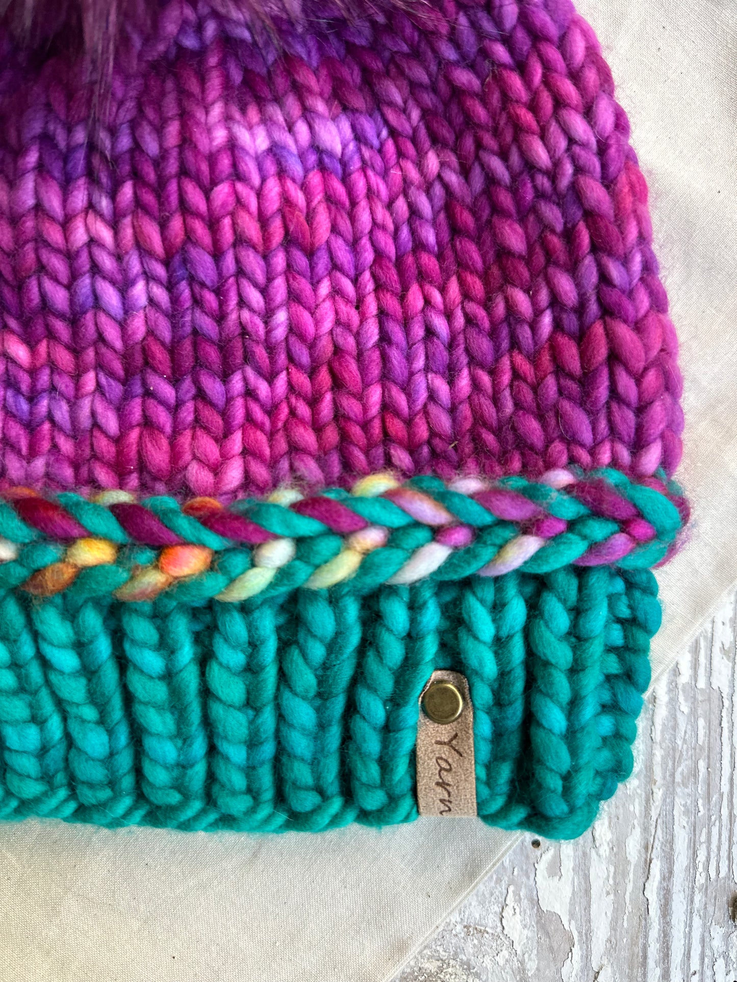 Merino wool knit hat with faux fur Pom