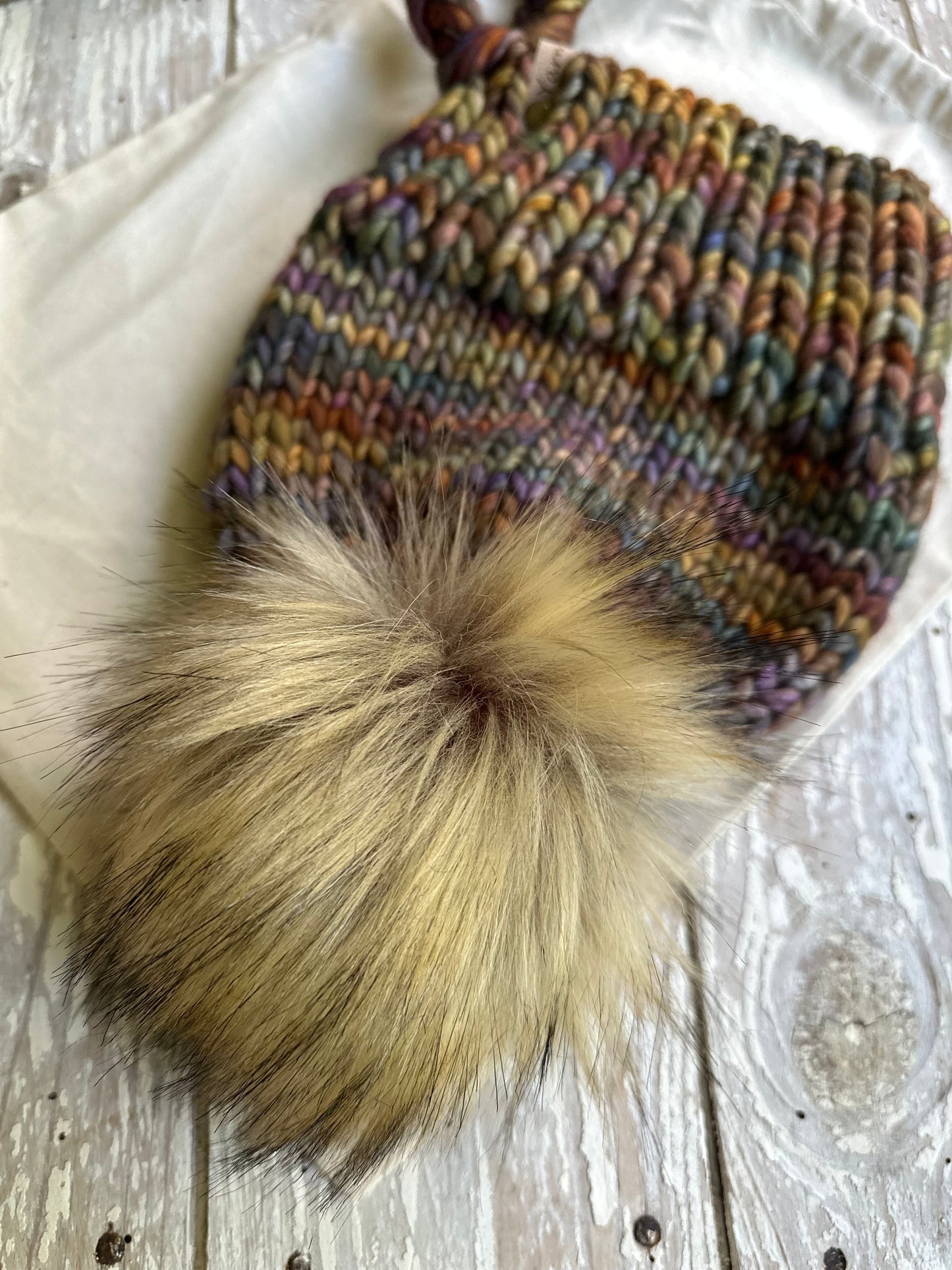 Merino wool split brim beanie with faux fur Pom