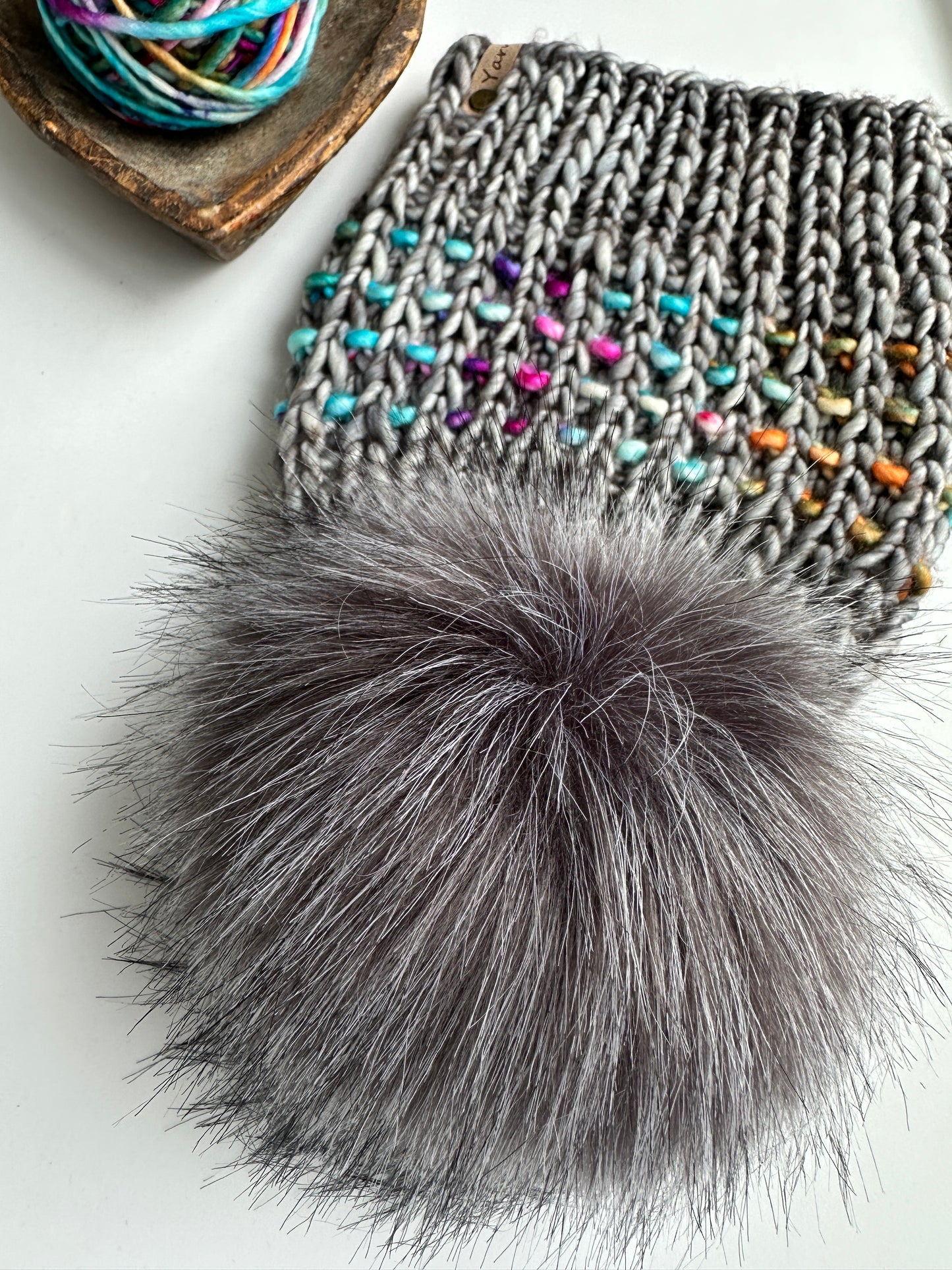 Merino wool knit hat with faux fur Pom