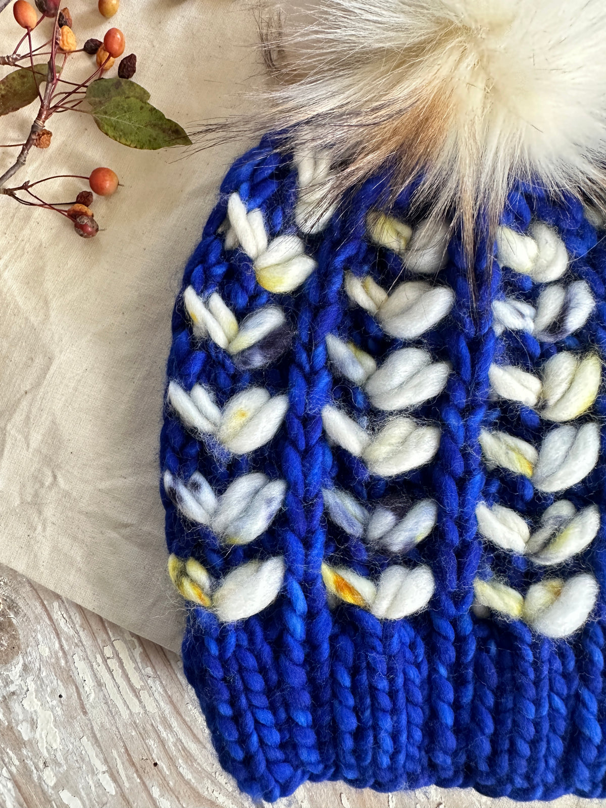 Merino wool knit hat with faux fur Pom