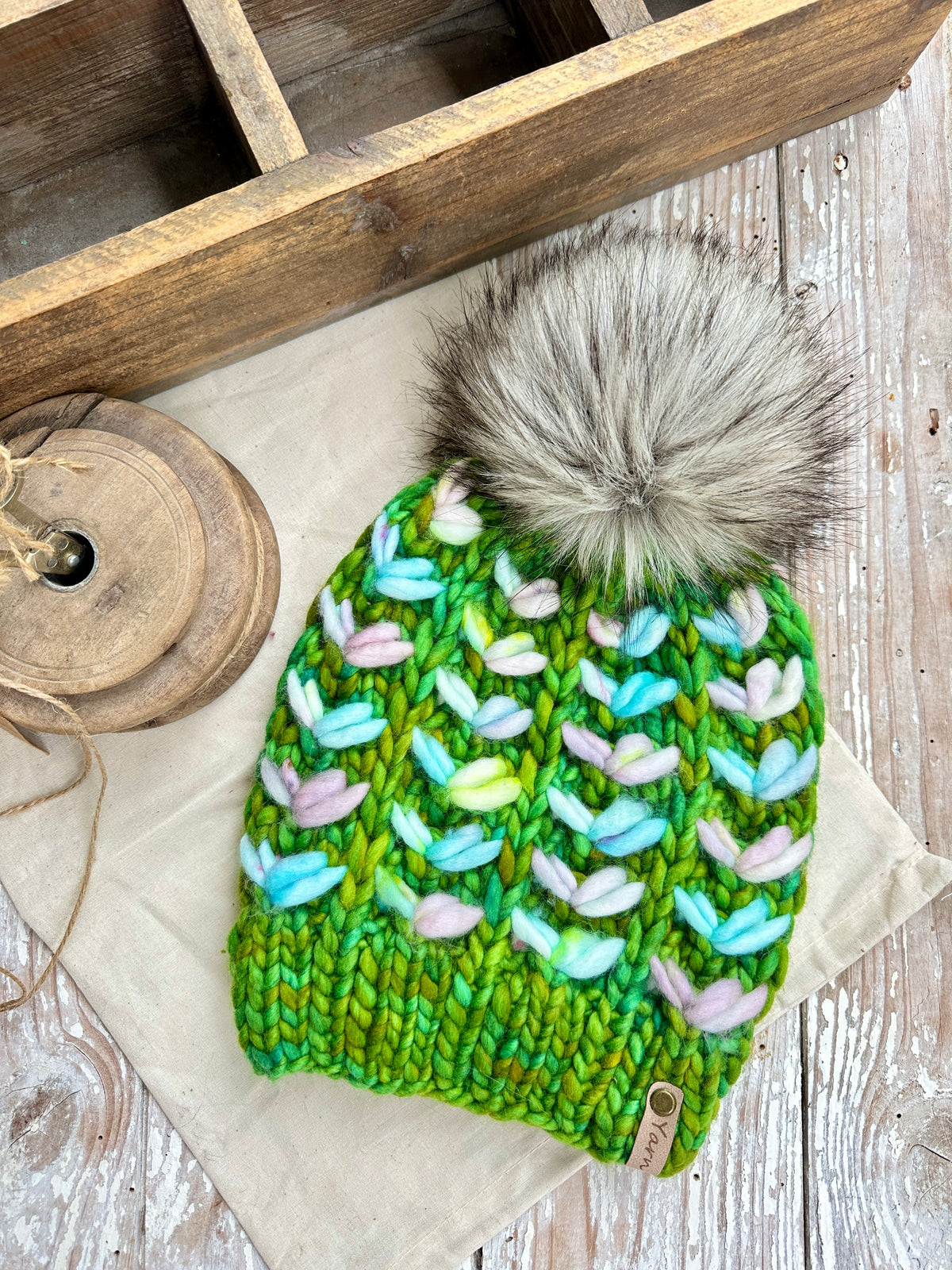 Merino wool knit hat with faux fur Pom