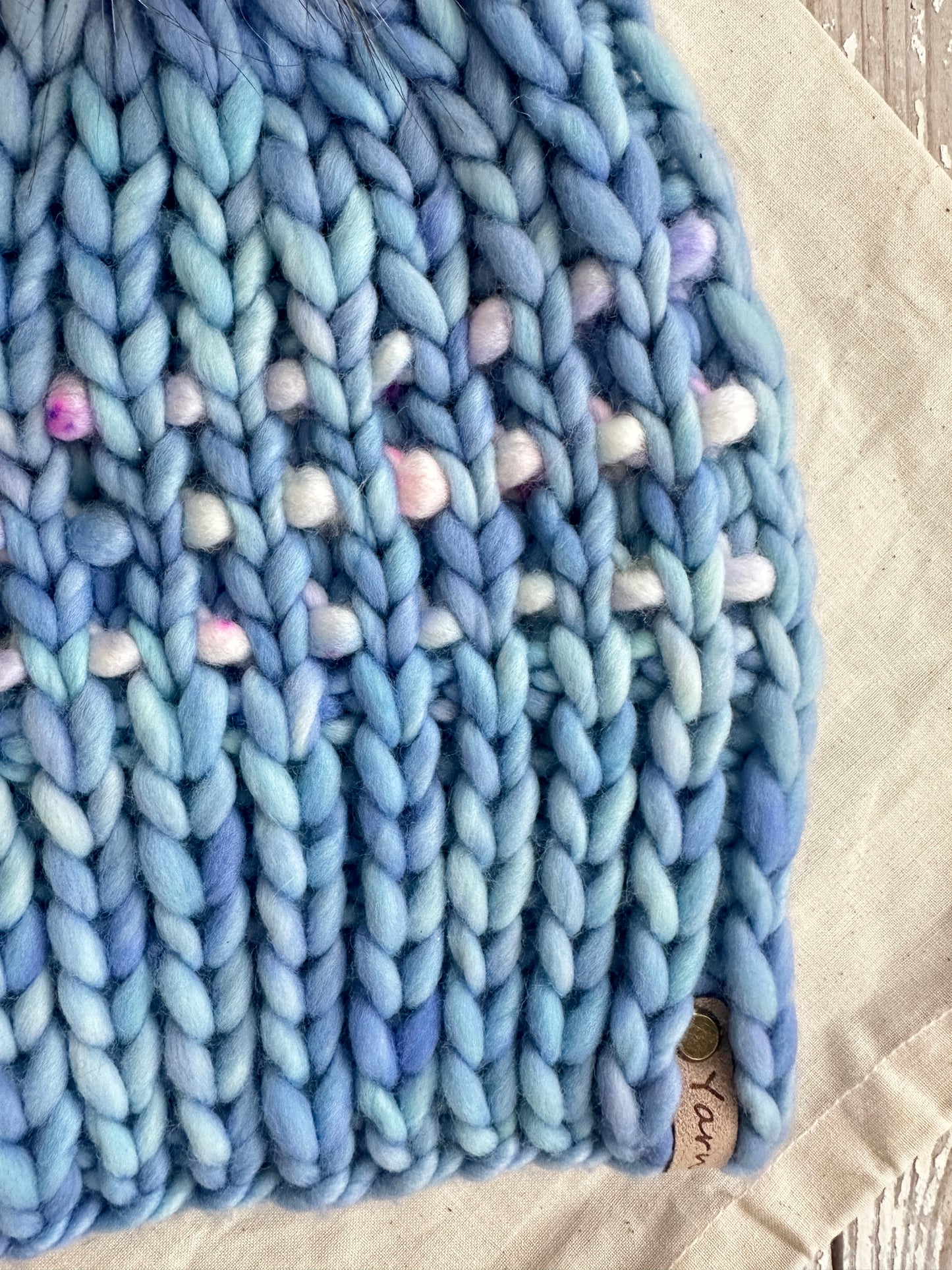 Merino wool knit hat with faux fur Pom