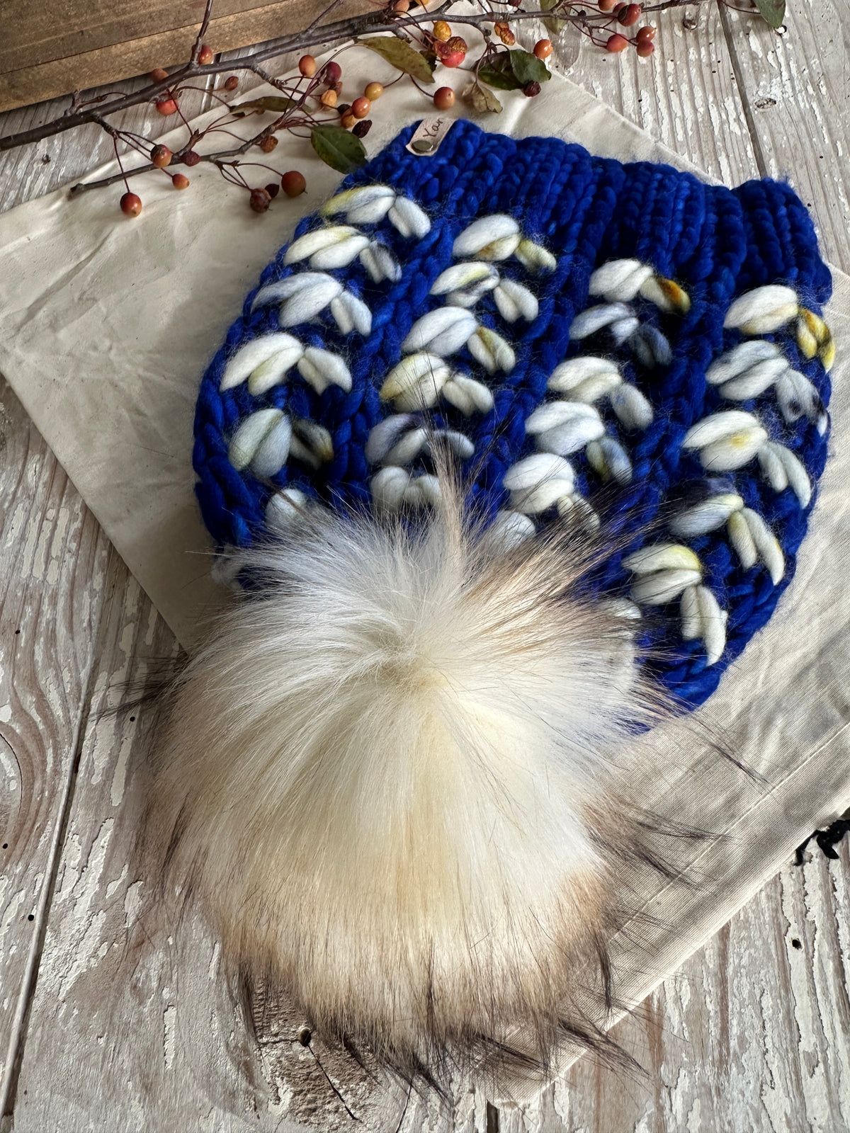 Merino wool knit hat with faux fur Pom