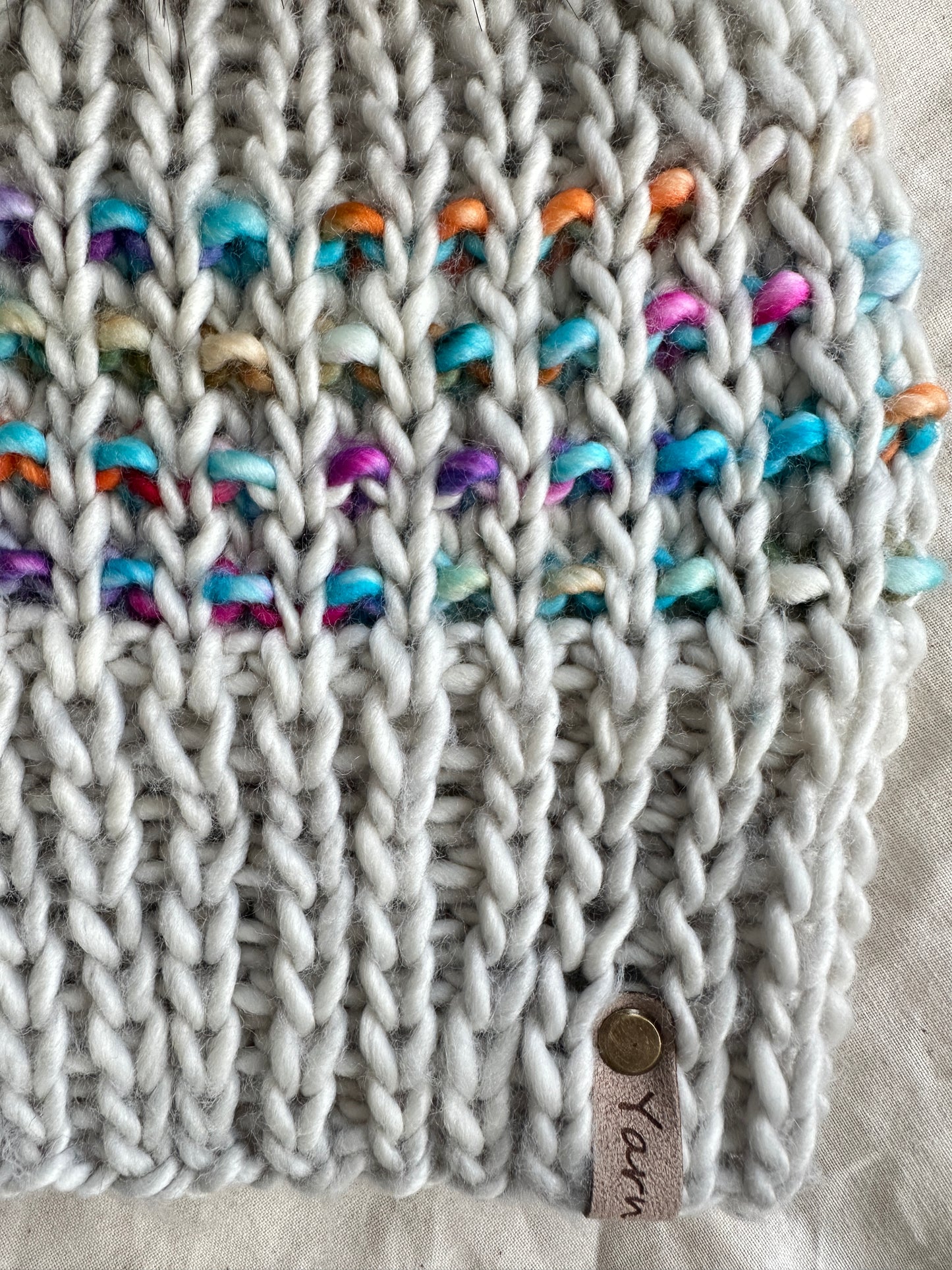 Merino wool knit hat with faux fur Pom