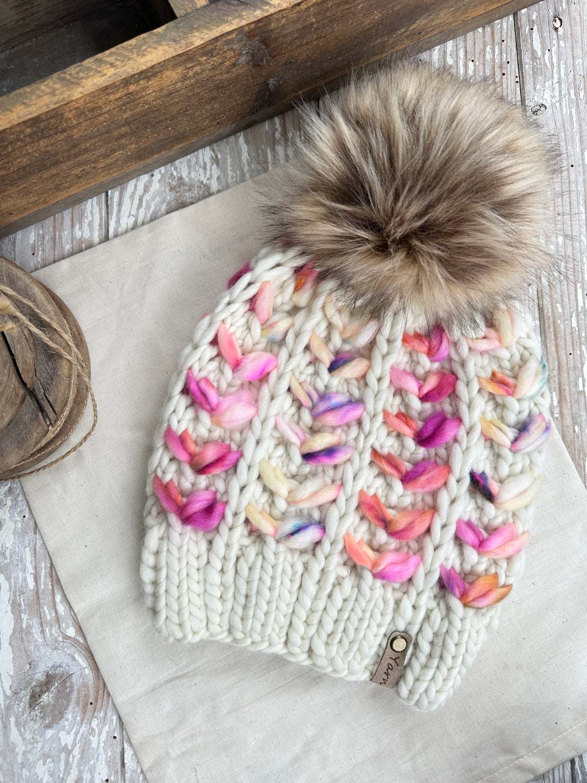 Merino wool knit hat with faux fur Pom